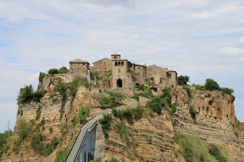 a very big pretty castle sitting on top of a mountain