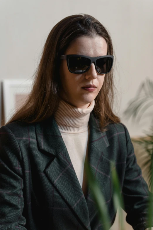 a woman with sunglasses sitting at a table