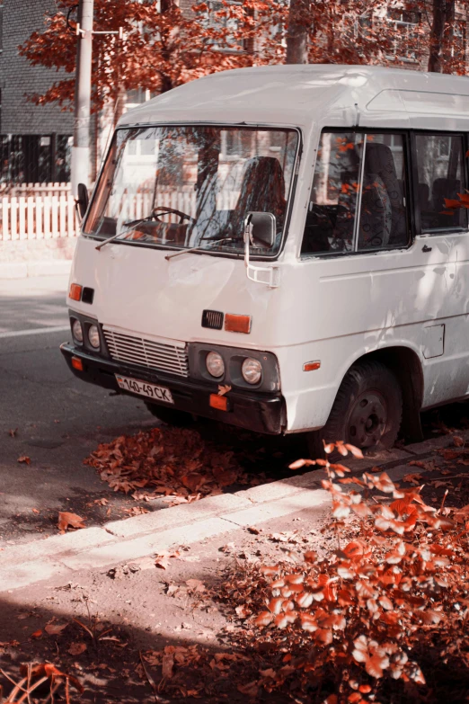 a white van parked on the side of a street