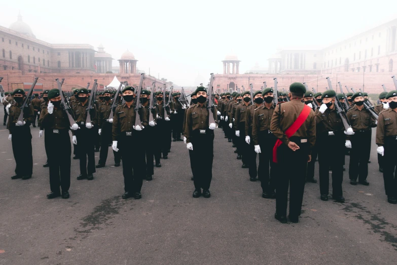 military men marching with their backs towards each other in formation