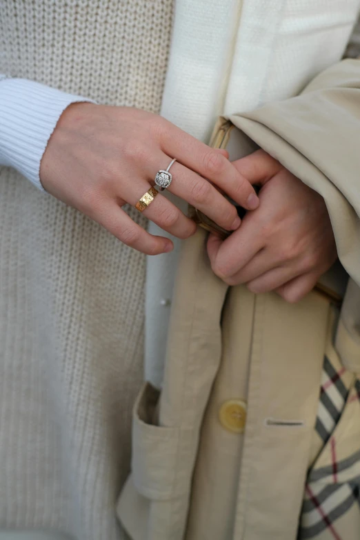 two people are holding hands in the middle of their outfits