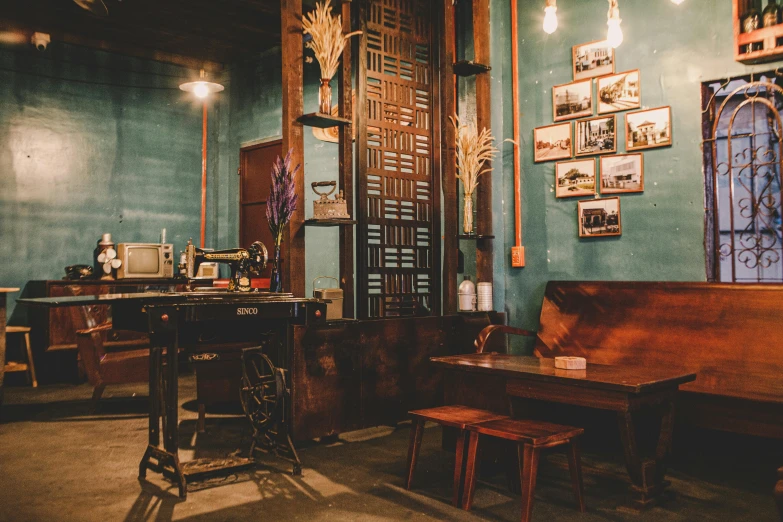 an old fashion building that has wooden furniture and blue walls