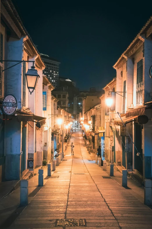 a long street in a city at night