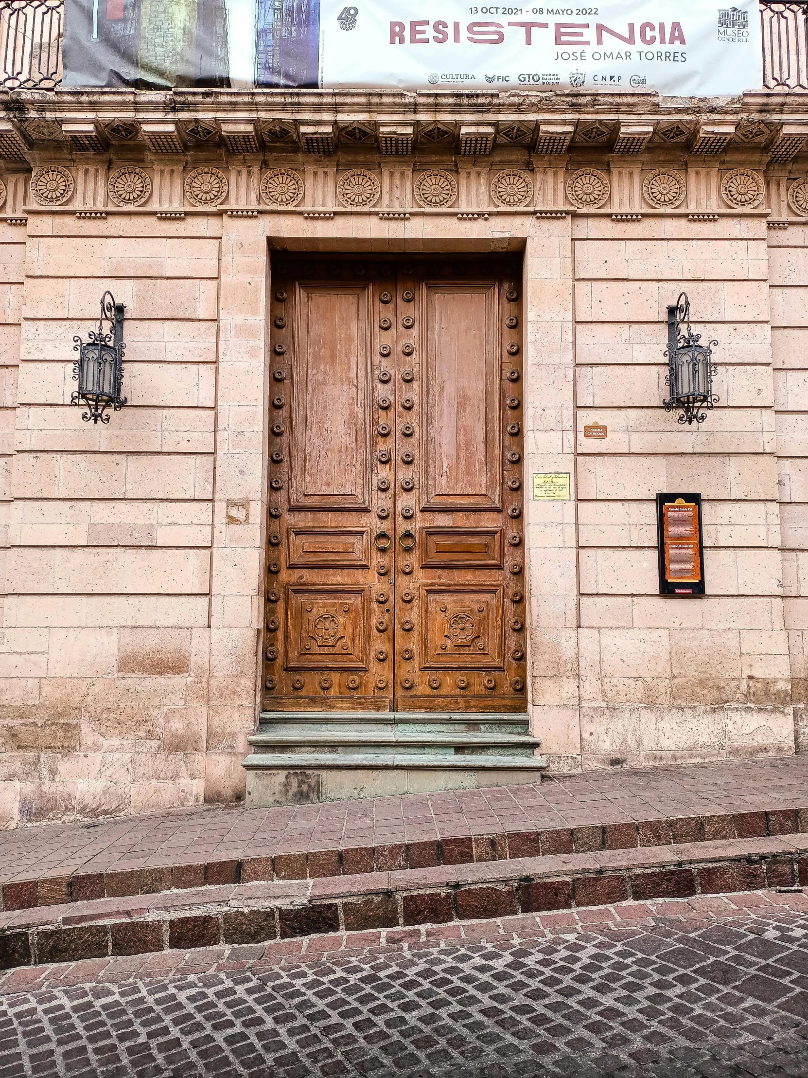 wooden door on a stone building in the city