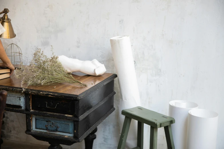 a table with items on it and a vase