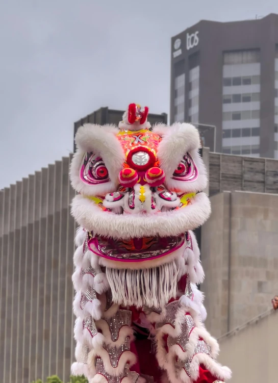 a dragon dance being held in a parade