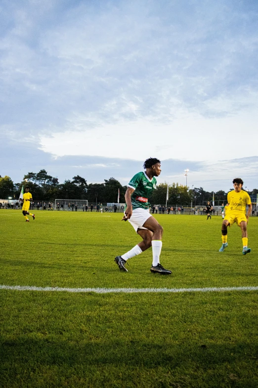 a soccer game that is going on during the day