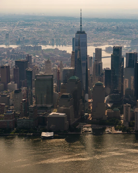 the city skyline is pictured as it reflects in water