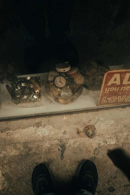 a man standing in front of a bunch of objects