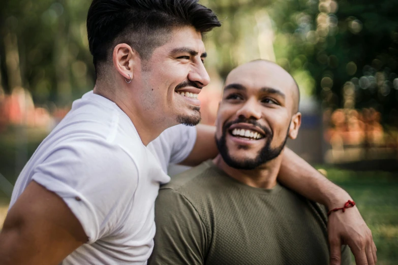 two young men who are having fun playing together