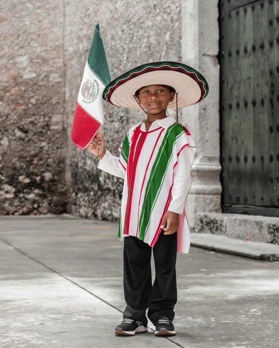  in a mexican outfit holding an american flag