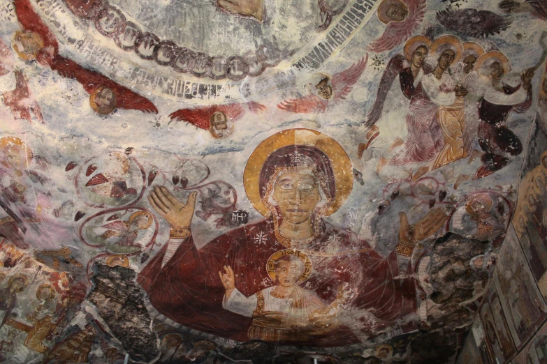 an intricately painted wall inside a cave