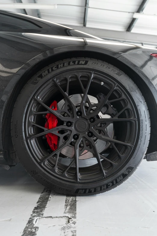 the wheel and rims on a black sports car