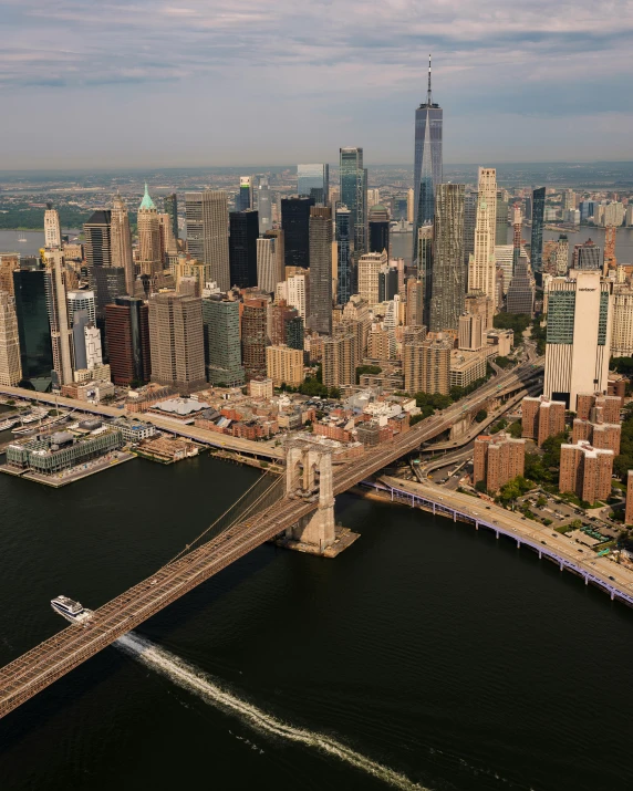 a wide city is shown next to an overhead bridge