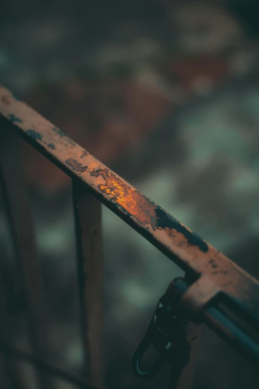 rusted metal rail sitting on the ground