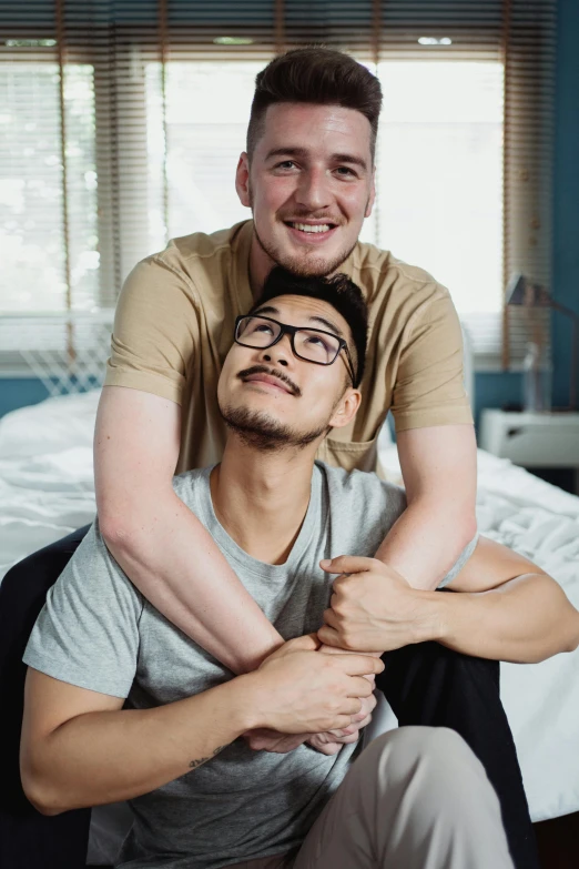 two men pose for a picture with their arms around each other