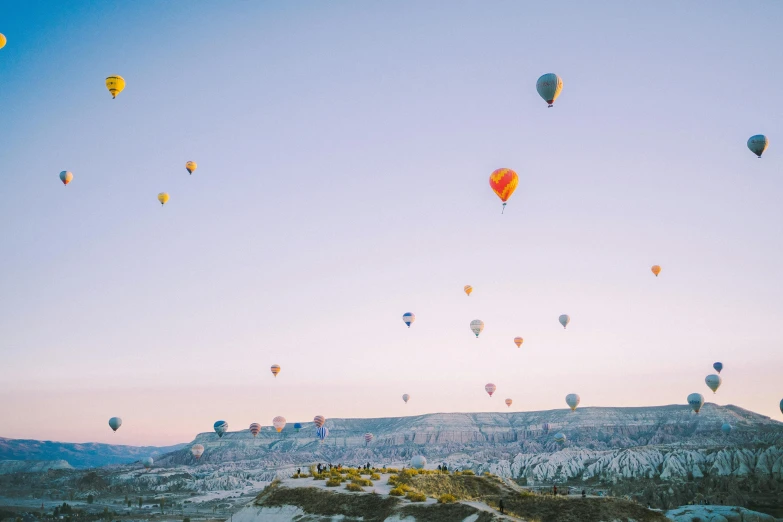 many colorful  air balloons floating in the sky