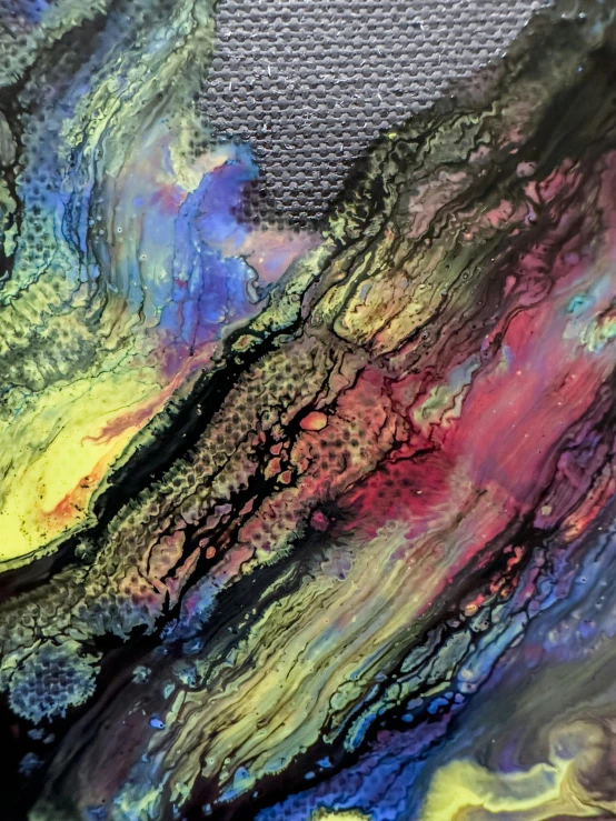 abstract art featuring liquid paint strokes with a multicolor background