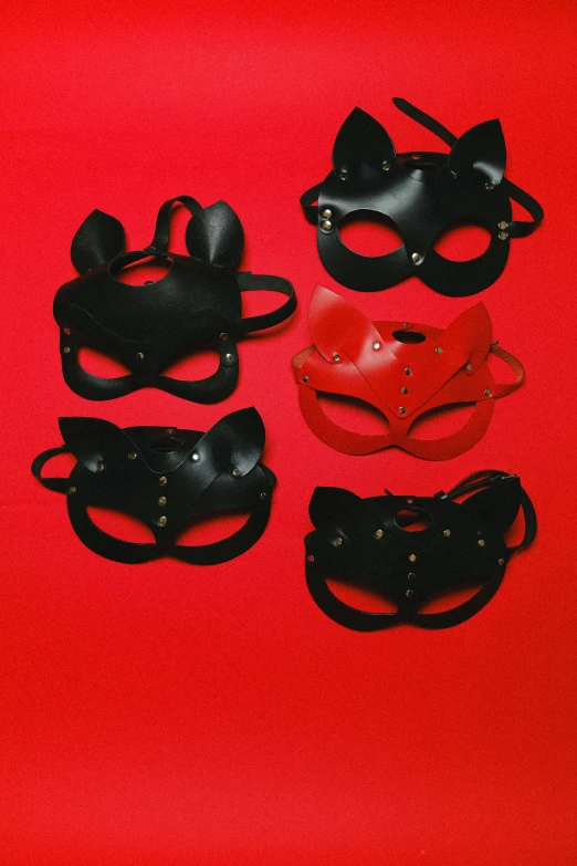 the black and red masks have ears on them