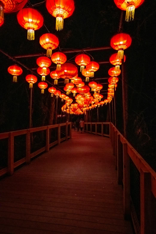 there is a pier with lights on both sides