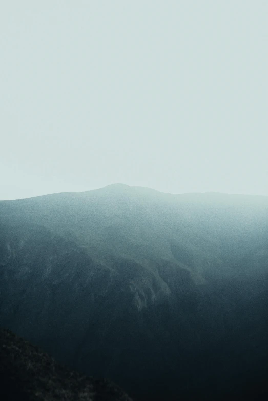 an image of a mountain view in a misty scene