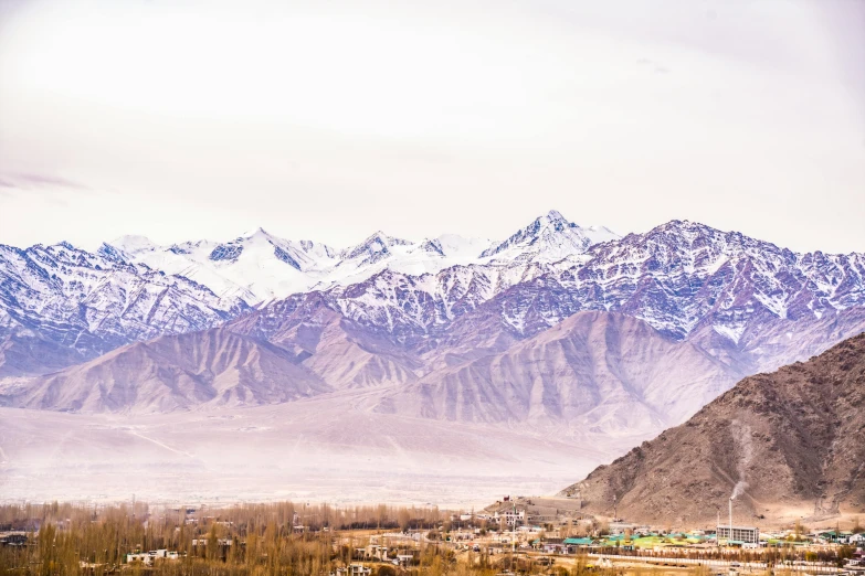 a village nestled in the middle of a mountain range