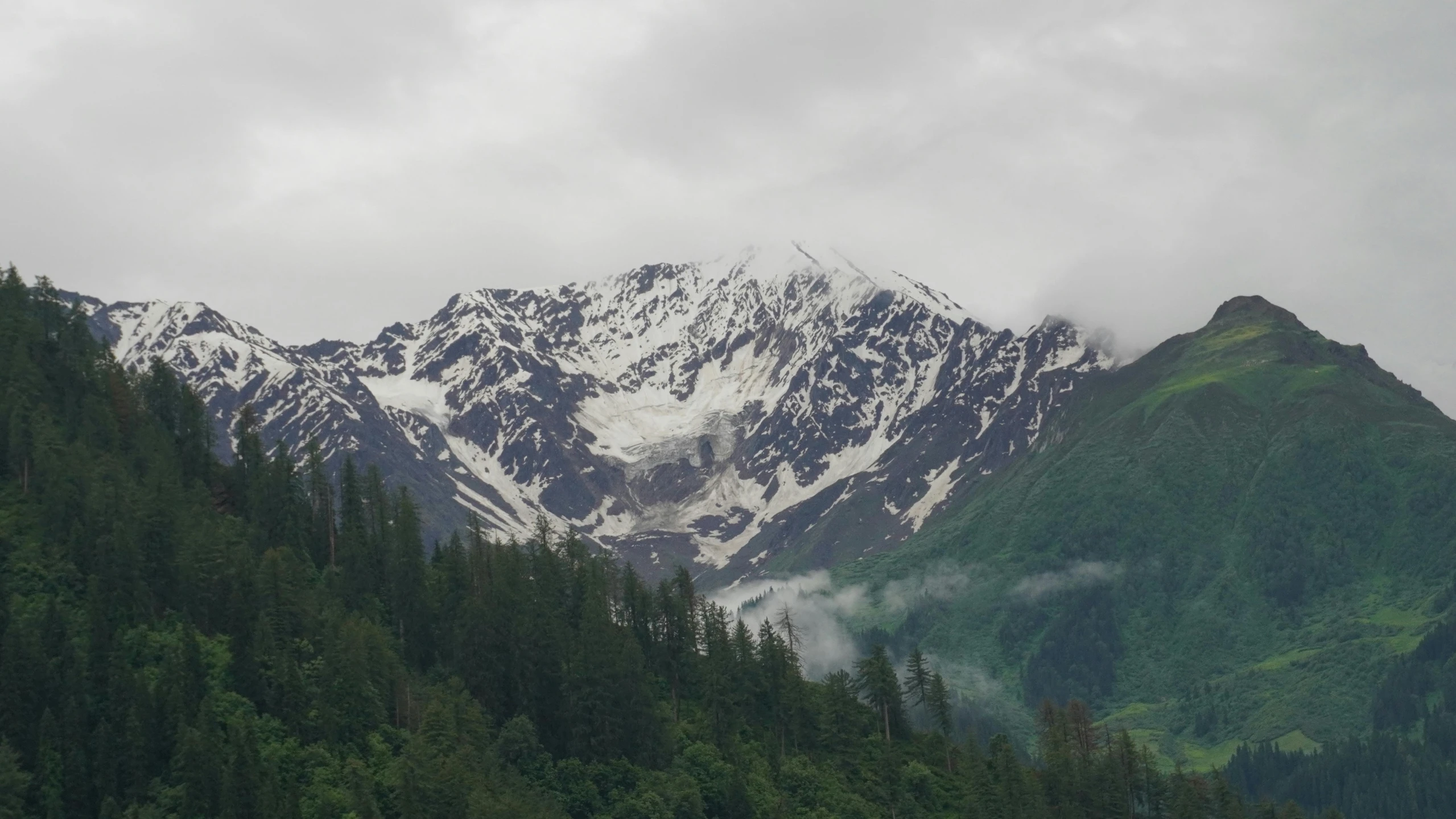 there is a mountain with lots of snow on it