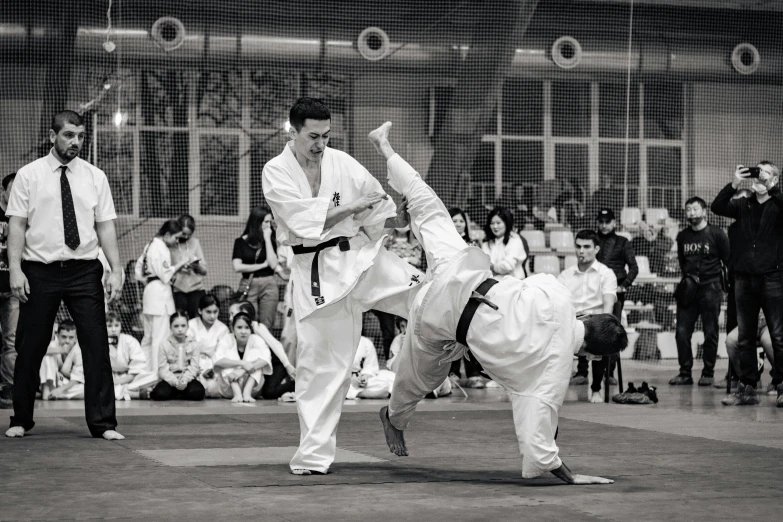 two men engaged in karate during a training session