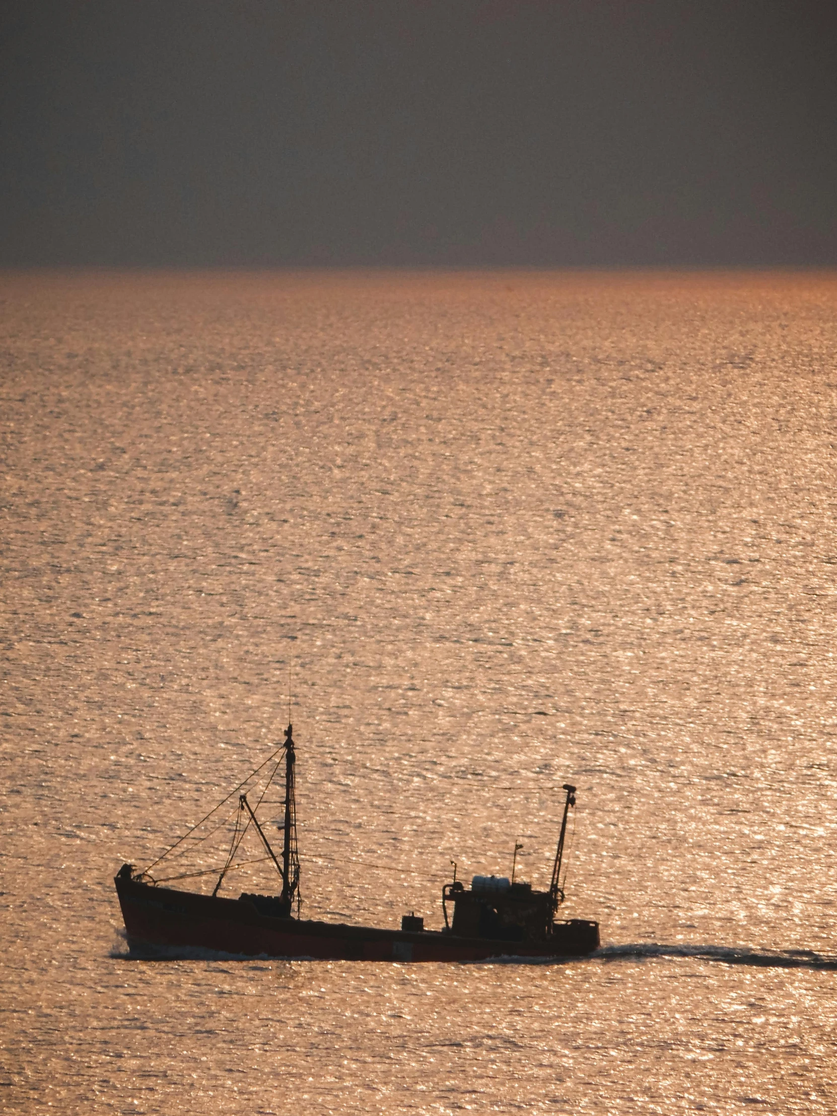 a small boat on a large body of water