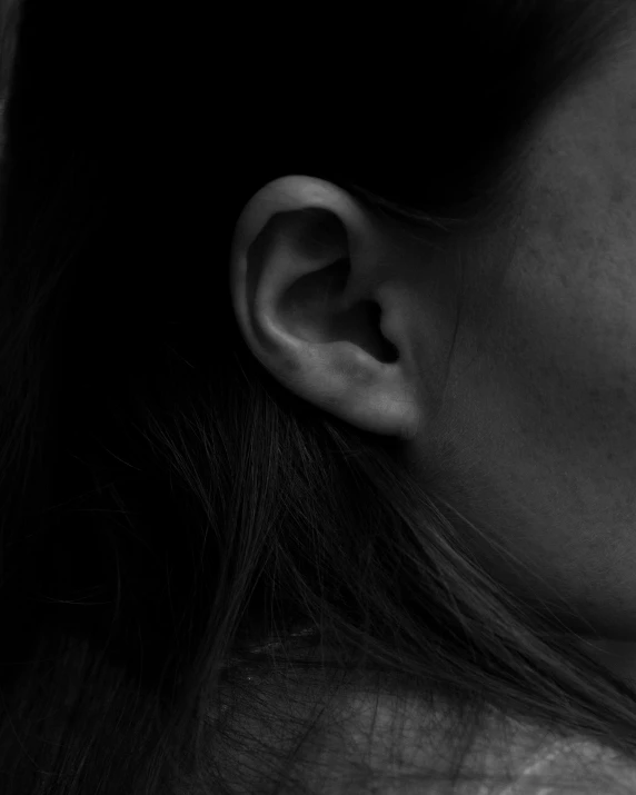 the back end of a woman's head with her nose missing