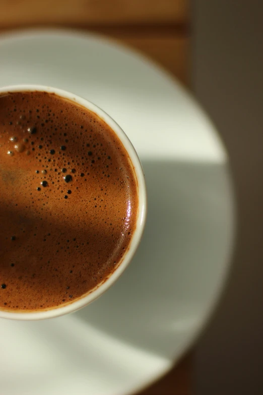 a cup of  chocolate on a saucer