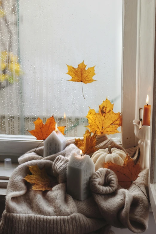 there are several candles sitting on the windowsill