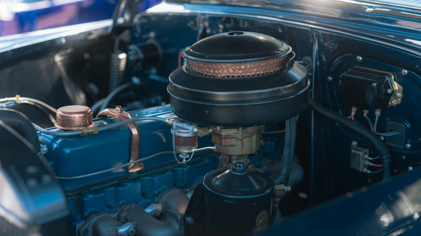 there is a blue engine in the old car