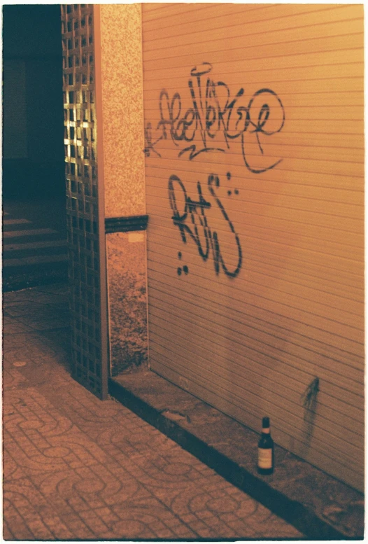 a po of graffiti on the wall by the door