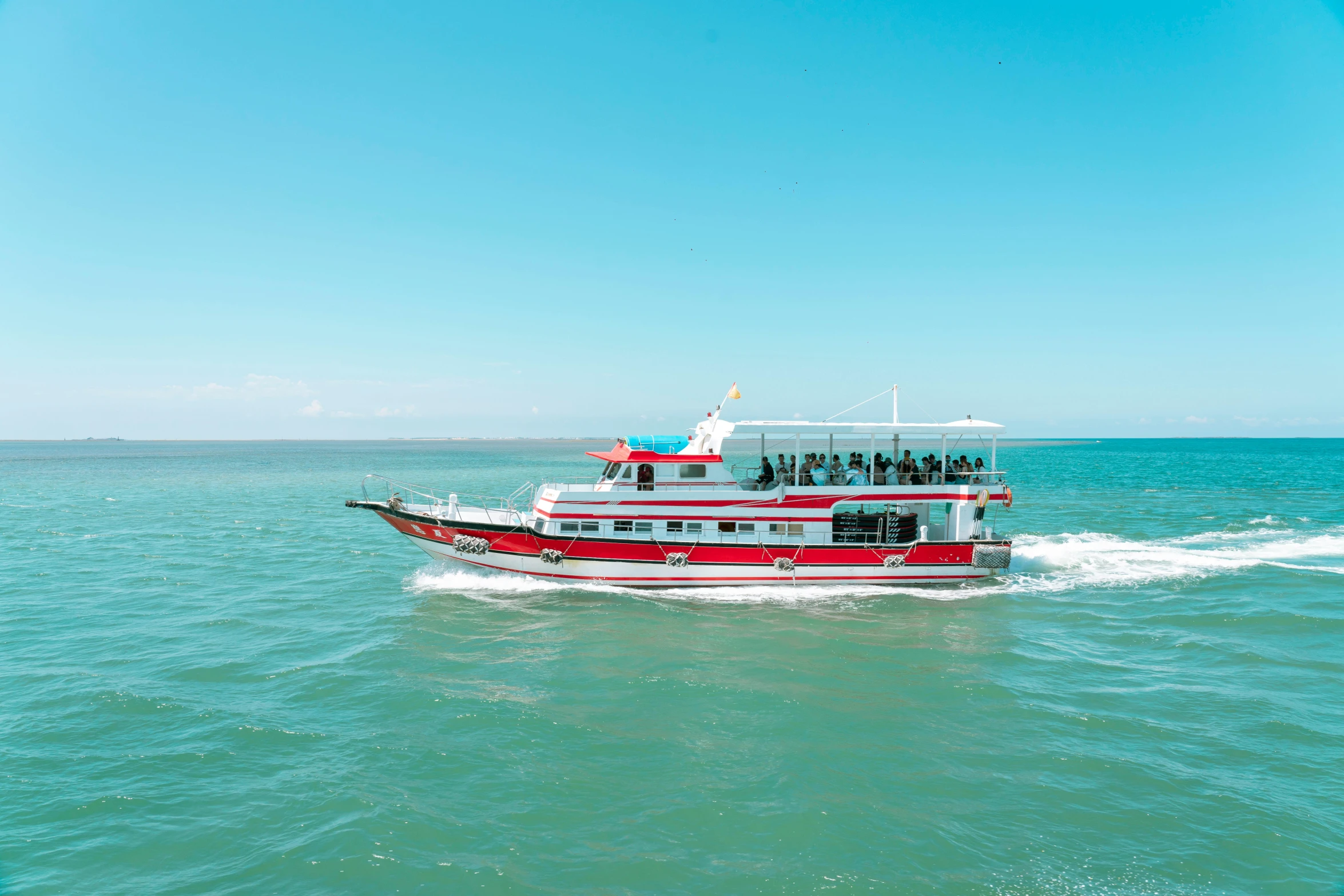 red and white boat sailing in blue water