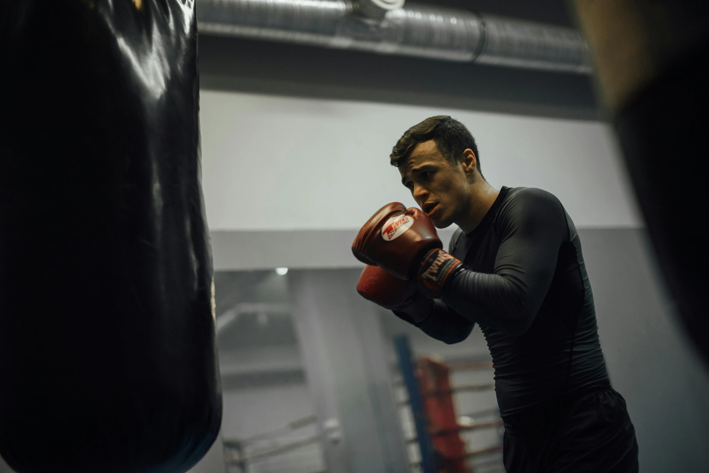 the man is training his boxing ss in the gym