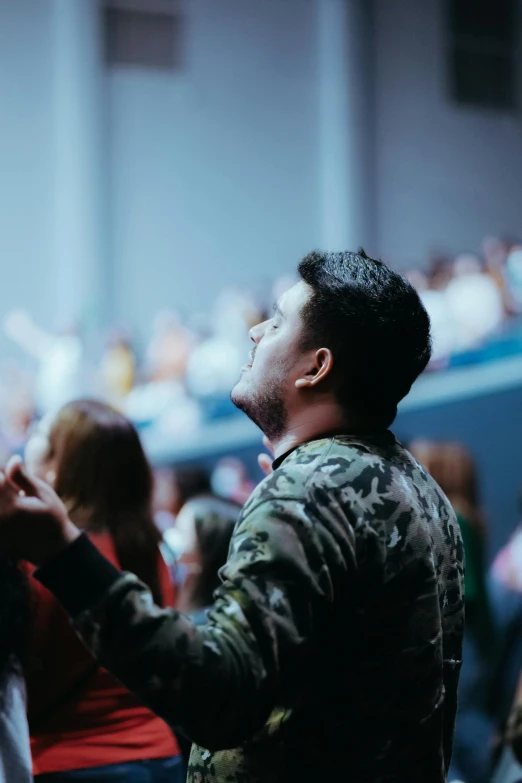 a guy holding his hands together during a performance