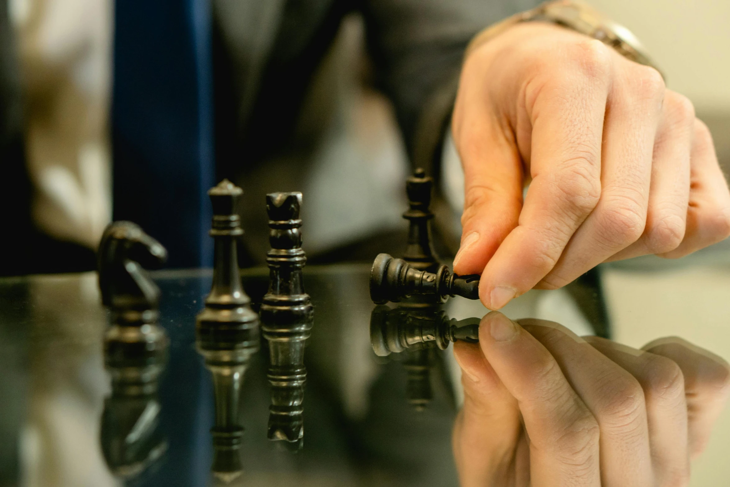 there is a person playing chess on the table