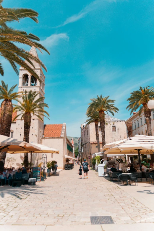 the people are walking around the town square