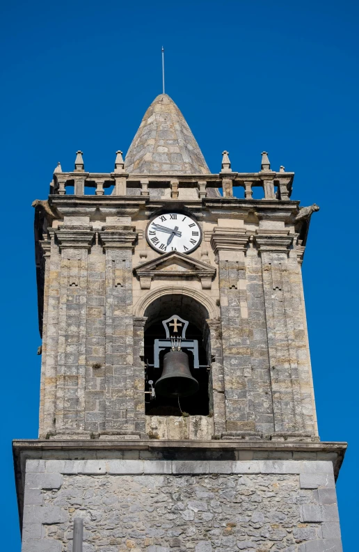 a very tall brick tower with a clock