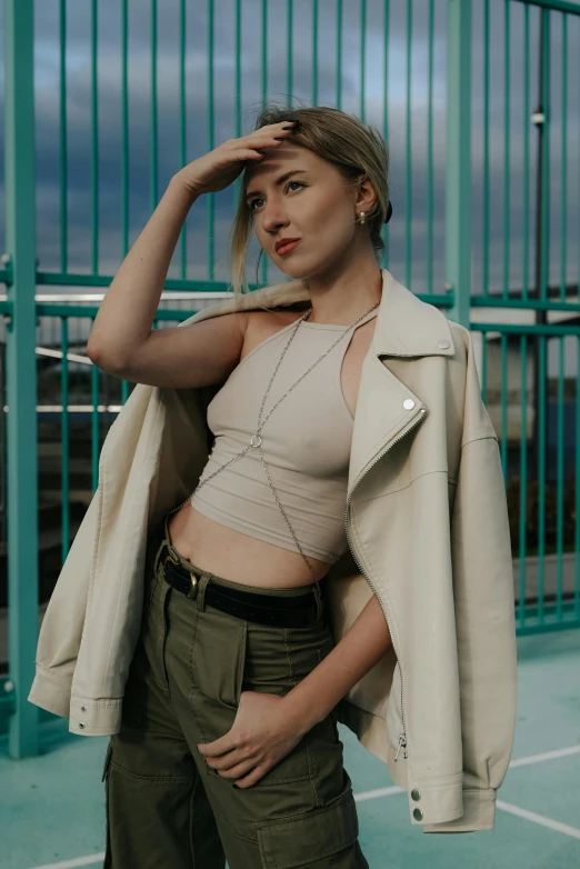 a woman posing with her hand on her hair