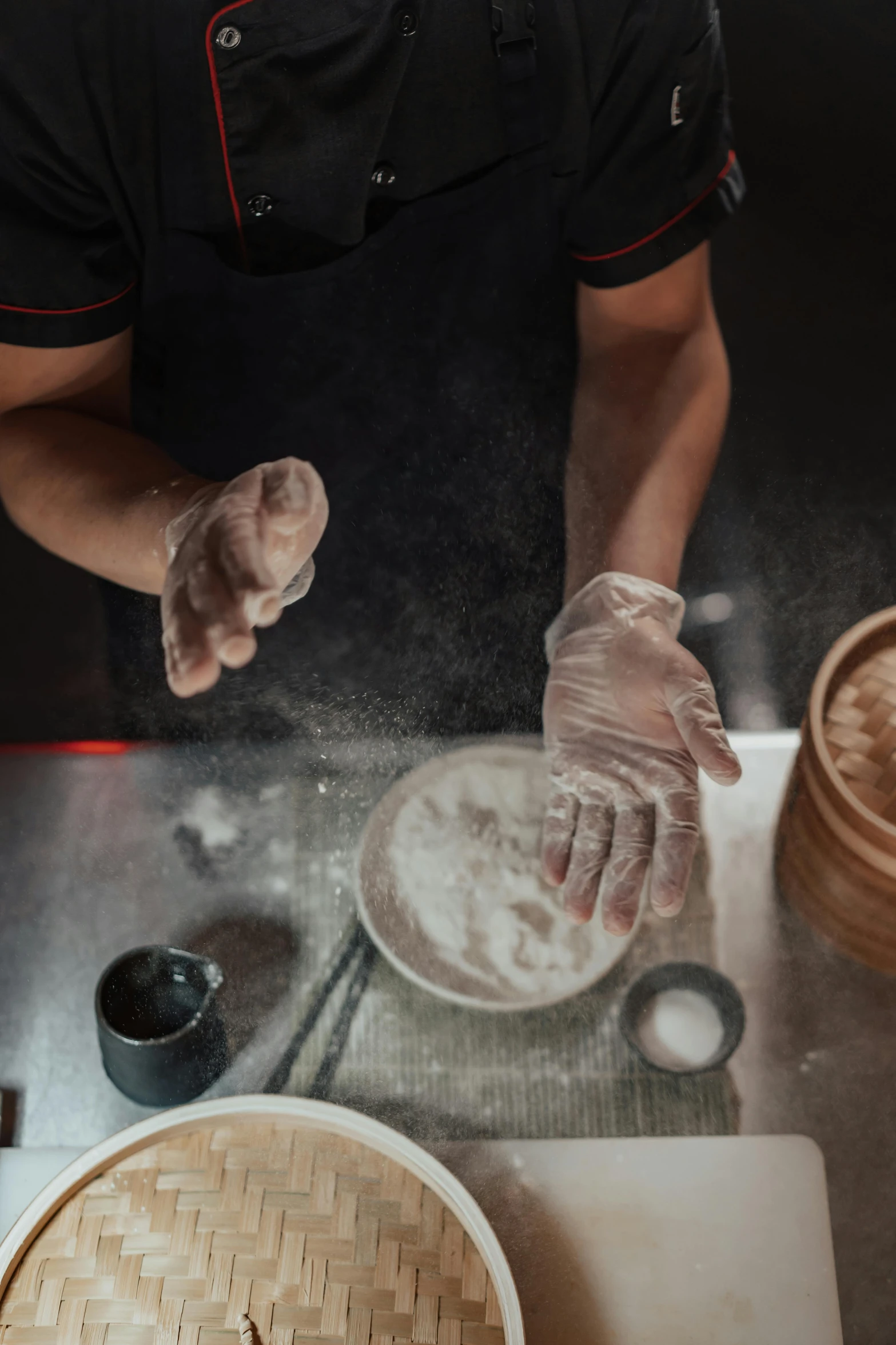 a chef preparing food in front of a frying pan