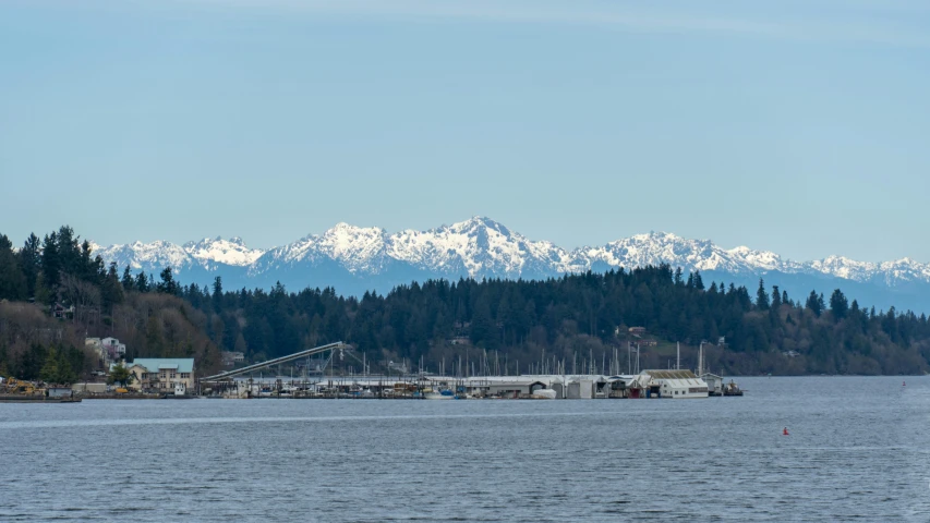 boats out on a large body of water near mountains