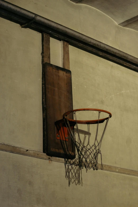 a basketball hoop is suspended from the wall