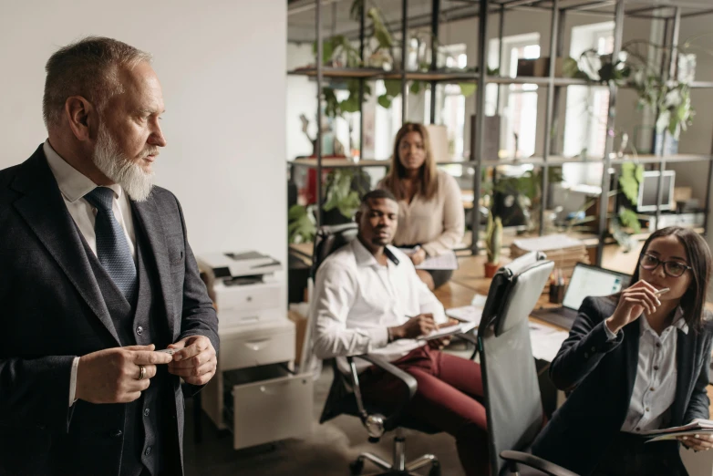 two business people giving a presentation to the group