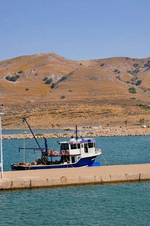 there is a boat that is tied up at the pier