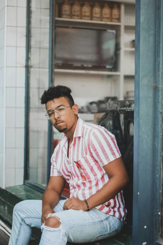 a man sitting on the steps looking sad