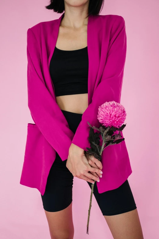 an attractive woman holding a bouquet of flowers