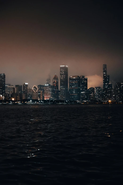 a nighttime skyline in seattle on a cloudy night