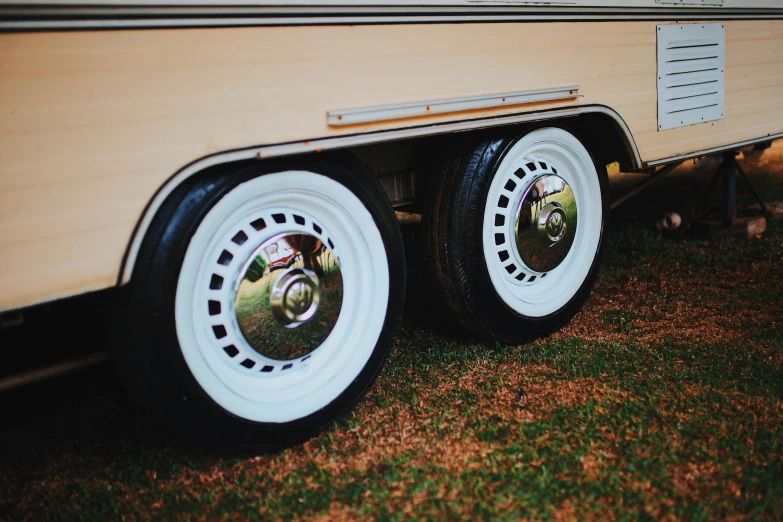 the rear wheels of a vintage motor home